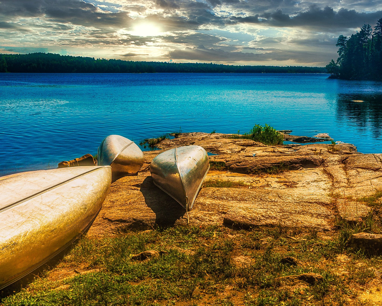 A wooden Minnesota puzzle of a boundary waters canoe area lake with canoes on the shorelines